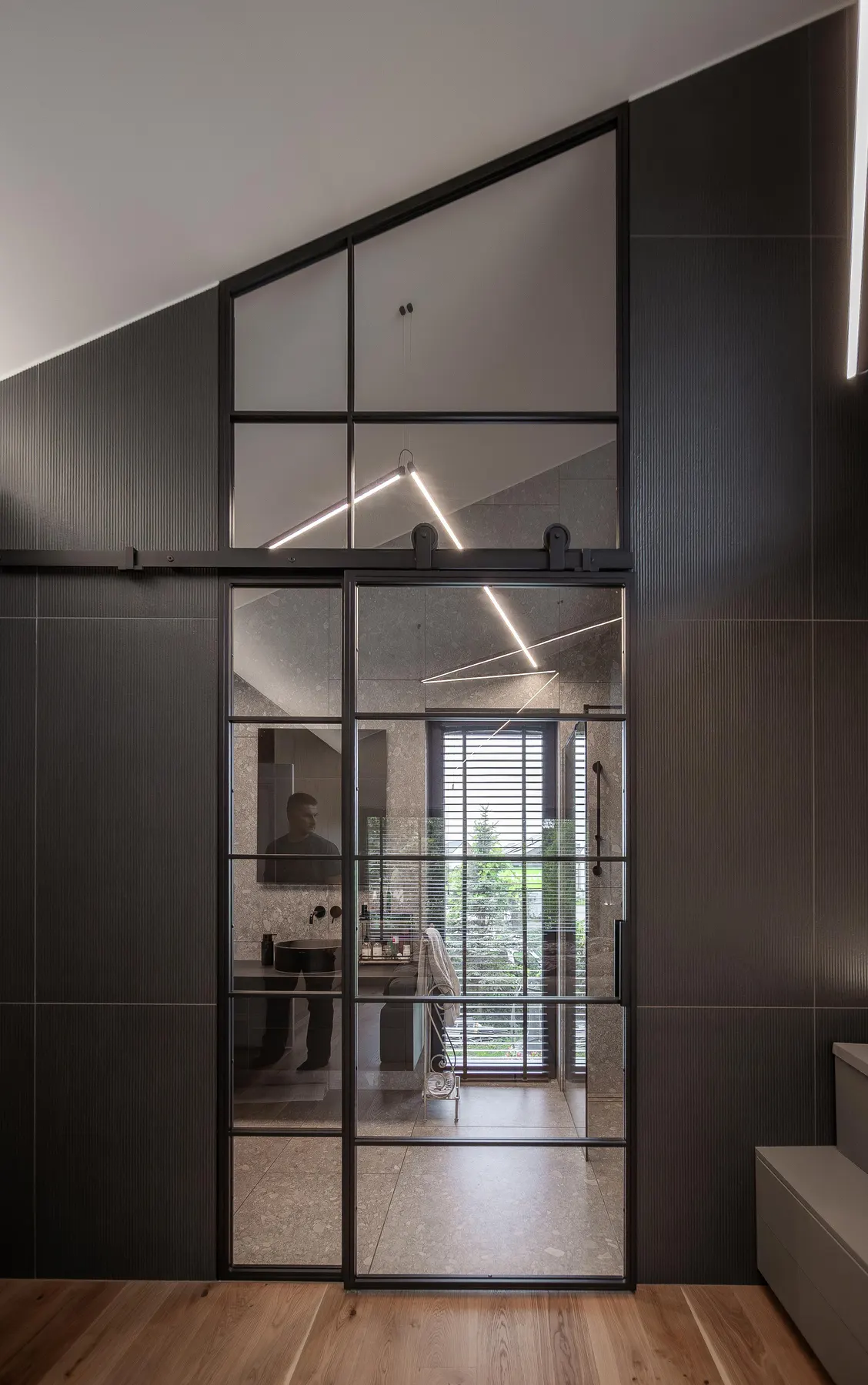 The Barn Bathroom, Richmond: steel sliding door with a full-height glazed screen, closed